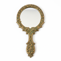 Victorian brass hand mirror with ornate floral engravings and aged patina